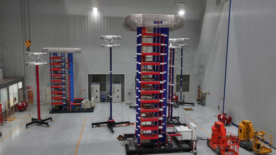 High-voltage impulse test towers inside the test hall